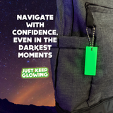 Navigation Glow Tag - 'Navigate With Confidence, Even In The Darkest Moments' - Just Keep Glowing. Bright green glow tag attached to a gray backpack against a starry night background. Emergency visibility tool for hiking, camping, and outdoor adventures. Reliable light source for navigating in low-light conditions. Essential safety gear for explorers. Long-lasting glow, no batteries needed
