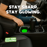 Man in luxury car with glowing green glow in the dark car coasters in cup holders and black shaker bottle – handmade Just Keep Glowing™ accessories.