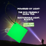 Eco-Friendly Glow Tile glowing green against night sky; a sustainable, reusable glow-in-the-dark light source powered by any light.