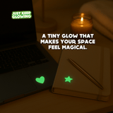 Glow in the dark stickers on a laptop and journal, cute desk accessories for students and professionals.