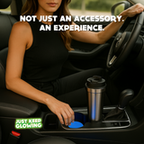 Woman in luxury car with stainless steel tumbler and glowing blue glow in the dark car coasters in cup holders – handmade Just Keep Glowing™ accessories for stylish driving.