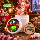 Open Elf Farts Christmas novelty jar with a round illustrated lid, sparkling peppermint and marshmallow fragrance, and a wooden Made in North Carolina ornament.