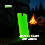 Reusable glow in the dark Forever Glow Bar attached to a hiking backpack, providing a visible marker for camping gear after dark.
