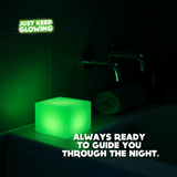 Glow Cube XL glowing by the bathtub as a night light, rechargeable glow cube safe for bathrooms and bedrooms.