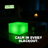 Glow Cube XL glowing during a power outage, rechargeable emergency light for home safety.
