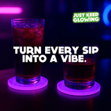 Glowing purple drink coasters under cocktail glasses in neon bar lighting – Just Keep Glowing™ glow in the dark coasters for drinks and parties.