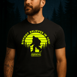 Men’s glow in the dark Bigfoot shirt with bright glowing print for camping and night adventures