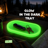 Glow in the dark tray used as a camping EDC organizer for keys, gear and essentials outdoors at night