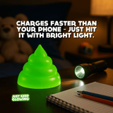 Rechargeable glow in the dark poop toy charging under flashlight, kids night light that glows for hours.