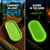 Green glow in the dark tray charging in light and glowing bright green in the dark reusable glow organizer tray