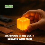 Handmade in the USA glow in the dark cube – durable resin stress relief fidget toy glowing with pride