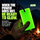 Hand holding a bright green Forever Glow Bar at a dark campsite, illustrating reusable glow in the dark gear for emergency preparedness, camping, and finding belongings during power outages.