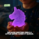 Child holding purple glow unicorn night light — a comforting and safe bedtime glow toy for kids