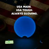 Blue glow in the dark car coaster with crescent notch, handmade in USA by Just Keep Glowing™ – luxury vehicle cup holder accessory with American flag background.